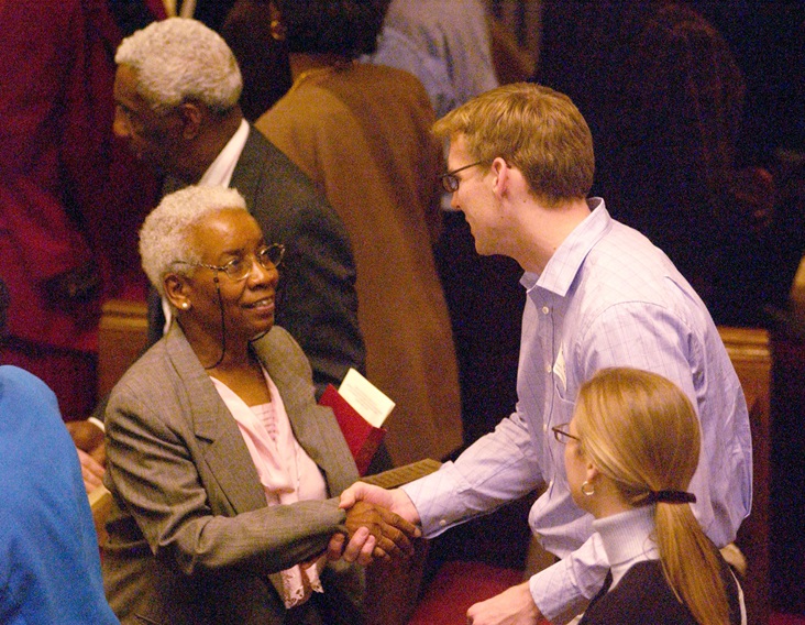 diversity-worship Parishioners of predominantly white Foundry United Methodist Church and predominantly black Asbury United Methodist Church in Washington greet each other during a 'service of confession and repentance.' A UMNS photo © Jay Mallin.